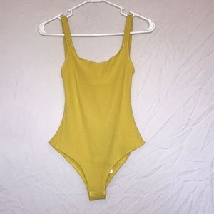 Yellow bodysuit